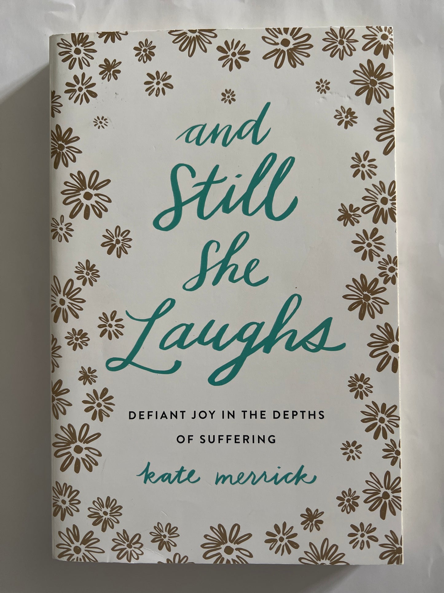 And Still She Laughs: Defiant Joy in the Depths of Suffering - Kate Merrick